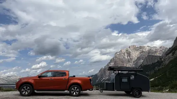 Caravan in mountain landscape